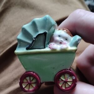 Green and Red Toy Baby Carriage